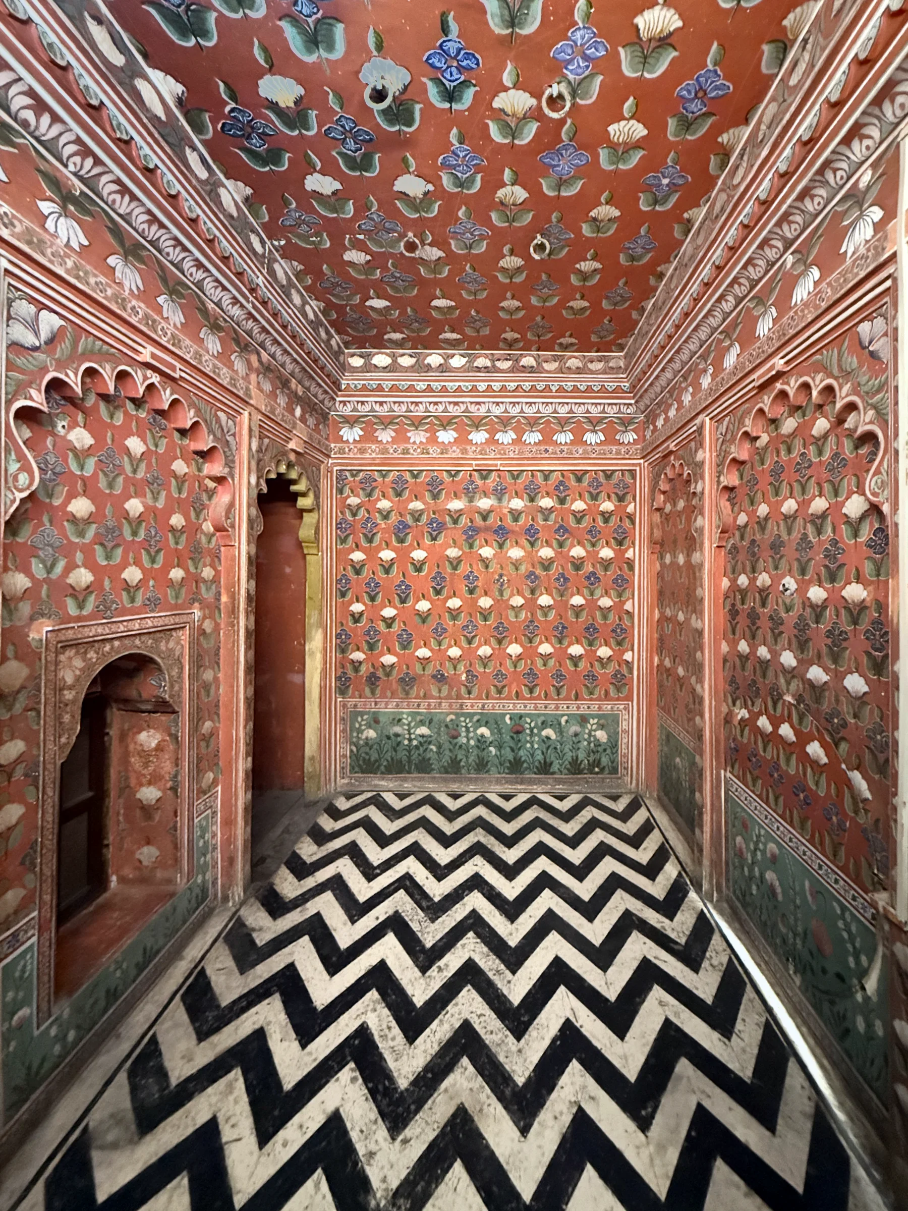 Painted interior with a black and white zigzag floor in Udaipur