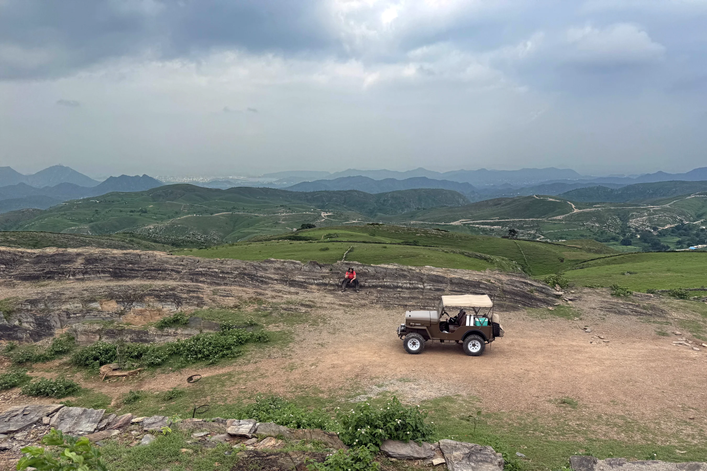 View over the hills near Udaipur with a jeep in the foreground